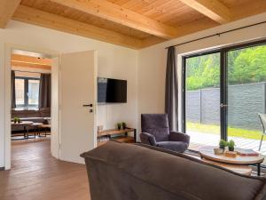 a living room with a couch and a table at Obermöschach 1 in Lake Pressegg