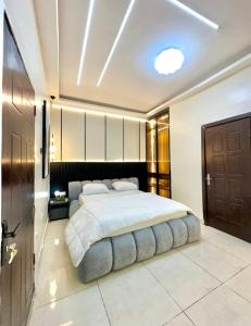 a large bedroom with a large bed in it at Djp in Lekki