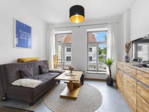 a living room with a couch and a tv at Lee in Wismar