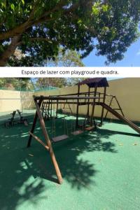 a playground with a wooden frame and a tree at Solar Pipa by Pipa Centro in Pipa