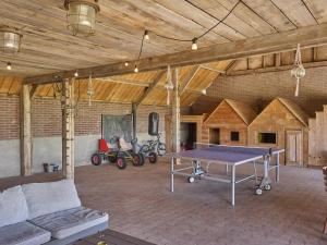 a large room with a ping pong table in it at De open schuur in Elsendorp