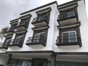 a white building with balconies on the side of it at Edificio San Antonio in Monterrey