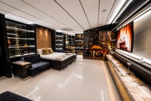 a living room with a couch and a fireplace at 1Million Suites in Medellín