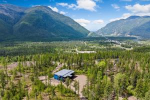 an aerial view of a cabin in the mountains at Glacier Luxury Retreat Oak Tree Apartment 3 in Hungry Horse