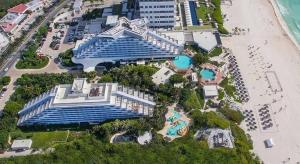 an aerial view of a resort near the beach at Beachfront Getaway Condo in Cancún