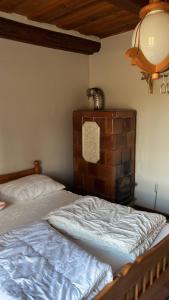 a bedroom with a twin bed and a lamp at Pokój i Spokój in Szarki