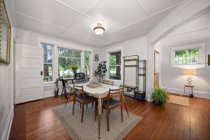 a dining room with a table and chairs at Chic Vintage Vibes Stylish Stay Near It All in Spokane