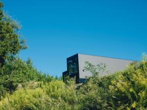 a building with a billboard on the side of it at BLANC yatsugatake 2026年4月24日グランドオープン in Hokuto
