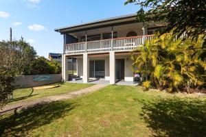a large house with a lawn in front of it at Ocean Vibes in Scotts Head