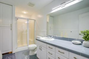 a bathroom with a toilet and a sink and a mirror at Easy AFB Commute! Clearfield Unit w/ Private Patio in Clearfield +13 photos