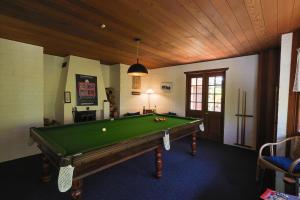 a billiard room with a pool table in it at Girraween Country Inn in Ballandean