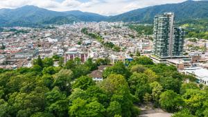 an aerial view of a city with mountains at Hotel Arboleda de Cádiz in Ibagué
