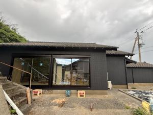 a house being constructed with a large glass window at Bluebase 波音 in Goto