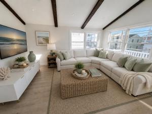 a living room with a couch and a table at Mermaid Manor in Brighton Beach