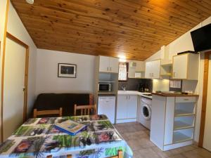 a small kitchen with a table in a room at Maison avec animaux admis - 4 pers. - API-1-52-2864 in Saint-Rome-de-Tarn