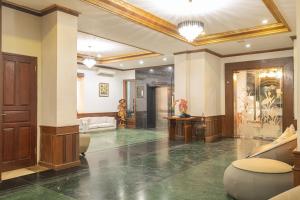 a living room with a lobby with a couch at Nirmala Heritage Hotel in Jimbaran +63 photos