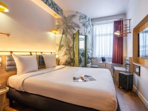 Postel nebo postele na pokoji v ubytování Ibis Styles Brussels Centre Rogier