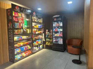 a grocery store with a aisle with food and drinks at Flat FM20 Apt 401 in João Pessoa