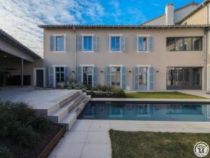 a house with a swimming pool in front of it at La villa saviesa in Cazères +43 photos