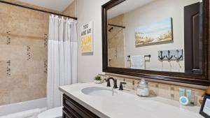 a bathroom with a sink and a mirror at Stimson Coastal Luxury by AvantStay in Pismo Beach +34 photos