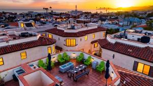 an aerial view of a house with the sunset in the background at Stimson Coastal Luxury by AvantStay in Pismo Beach