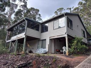 a house with a lot of windows on it at The Perch in Nornalup