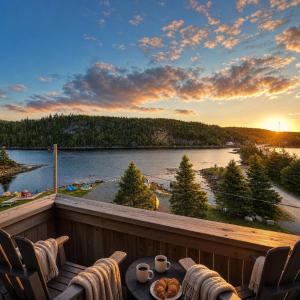 a view of a lake from the deck of a house at Jeddore Lodge in Head of Jeddore