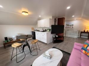 a living room with a couch and a table at Jeddore Lodge in Head of Jeddore