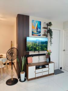 a living room with a flat screen tv at Villa Bosque - Forest Residences in Antipolo