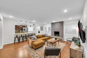 a living room with a couch and a fireplace at FIFA World Cup Backyard Retreat in Dallas
