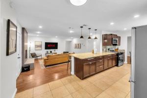 an open kitchen and living room with a couch at FIFA World Cup Backyard Retreat in Dallas