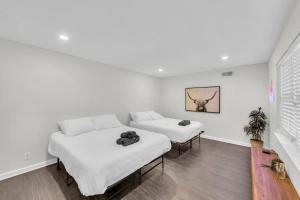 a living room with two beds and a couch at FIFA World Cup Backyard Retreat in Dallas