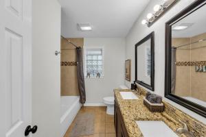 a bathroom with two sinks and a shower at FIFA World Cup Backyard Retreat in Dallas +33 photos