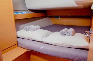 two beds in the cabin of a boat at Adria Yacht Porto Montenegro in Tivat