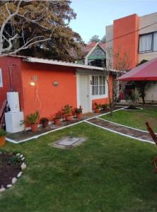 a house with a lawn in front of it at Posada del Jardín in Huasca de Ocampo +3 photos