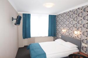 Posteľ alebo postele v izbe v ubytovaní Hotel Mazowiecki Łódź