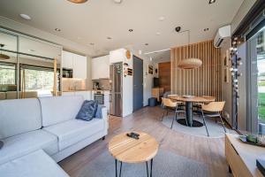 a living room with a couch and a table at Levi Platinum Aurora in Levi +29 photos