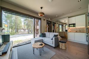 a living room with a couch and a table at Levi Platinum Aurora in Levi