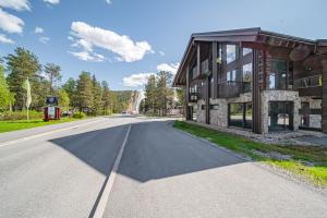 an empty road in front of a building at Levi Platinum Aurora in Levi
