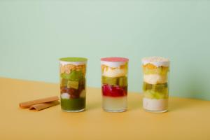 three glass jars filled with different types of fruit at Gion Ryokan Karaku in Kyoto