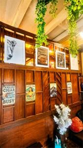 a wooden wall with pictures and pictures on it at Escape Retreat Hunza in Karimabad Hunza