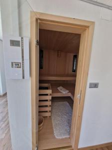 an open door to a room with a kitchen at Počitniška hiša Maja v naravi in Planina pri Sevnici +15 photos