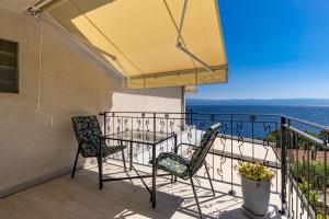 a balcony with a table and two chairs at Beachside Villa Mia Apartments in Medveja