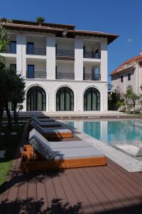 a hotel with a swimming pool and a building at CITADEL Heritage Hotel Berat in Berat