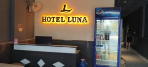 a hotel lobby with a drink cooler in a restaurant at Hoài Thu Luna Hotel in Ðông Hòa