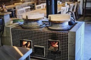 a couple of pots sitting on top of a fireplace at 蔵Mping Hotel in Fukaya +38 photos