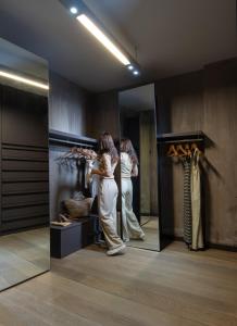 two women are standing in a dressing room at Luxury Villa Christina in Makrygialos