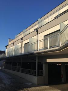 a building with a balcony on the side of it at Seminarhotel Daniels in Gols