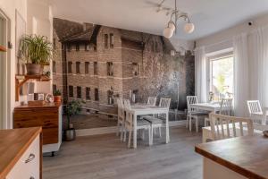 a dining room with a wall mural of a building at C Apartments Annedal in Gothenburg