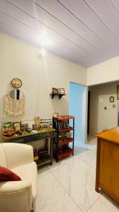 a living room with a couch and a table at Hospedagens da Lucia in Pirenópolis
